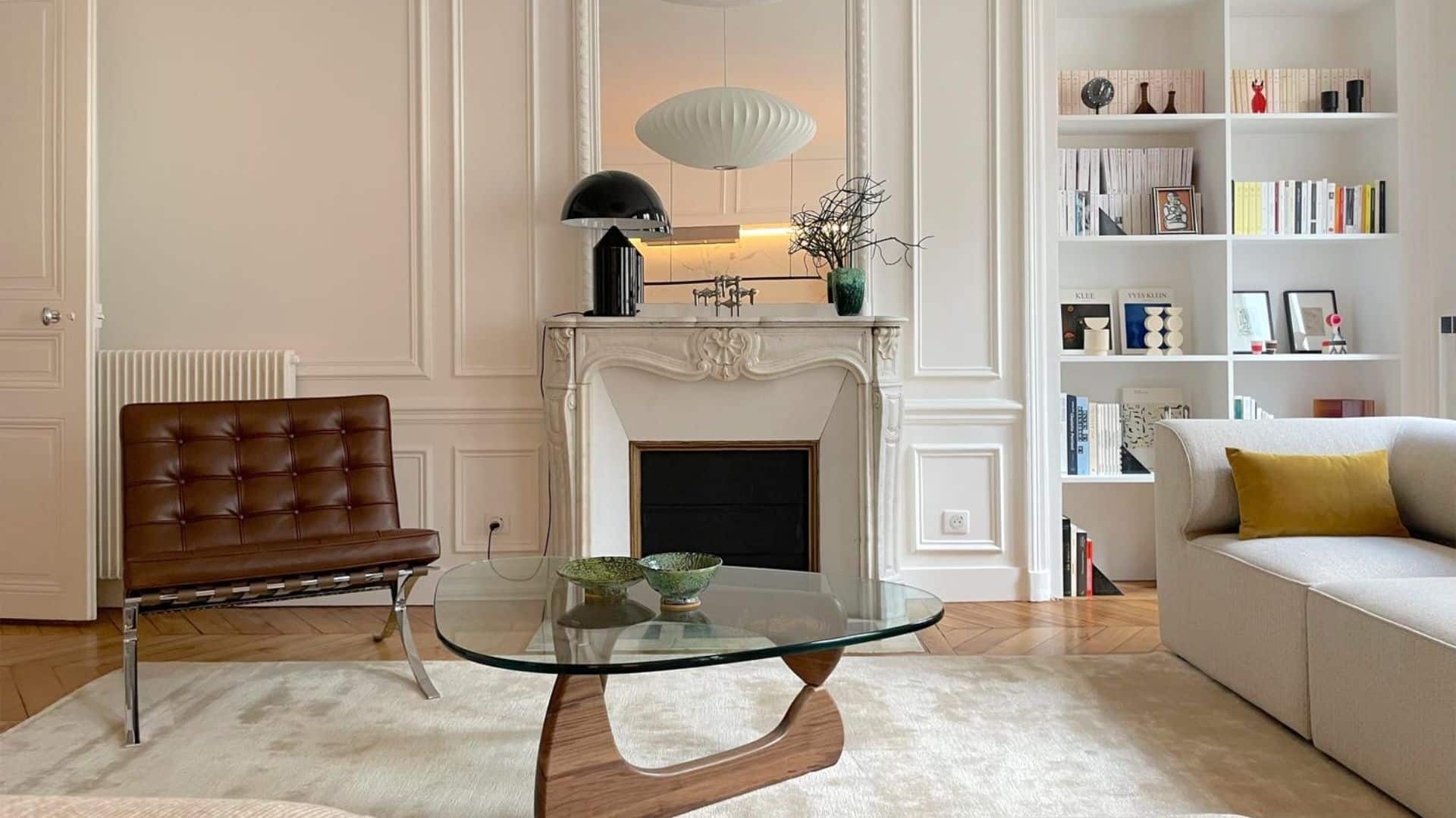 Elegant Paris apartment renovation featuring Haussmannian details and modern interior design in the Marais