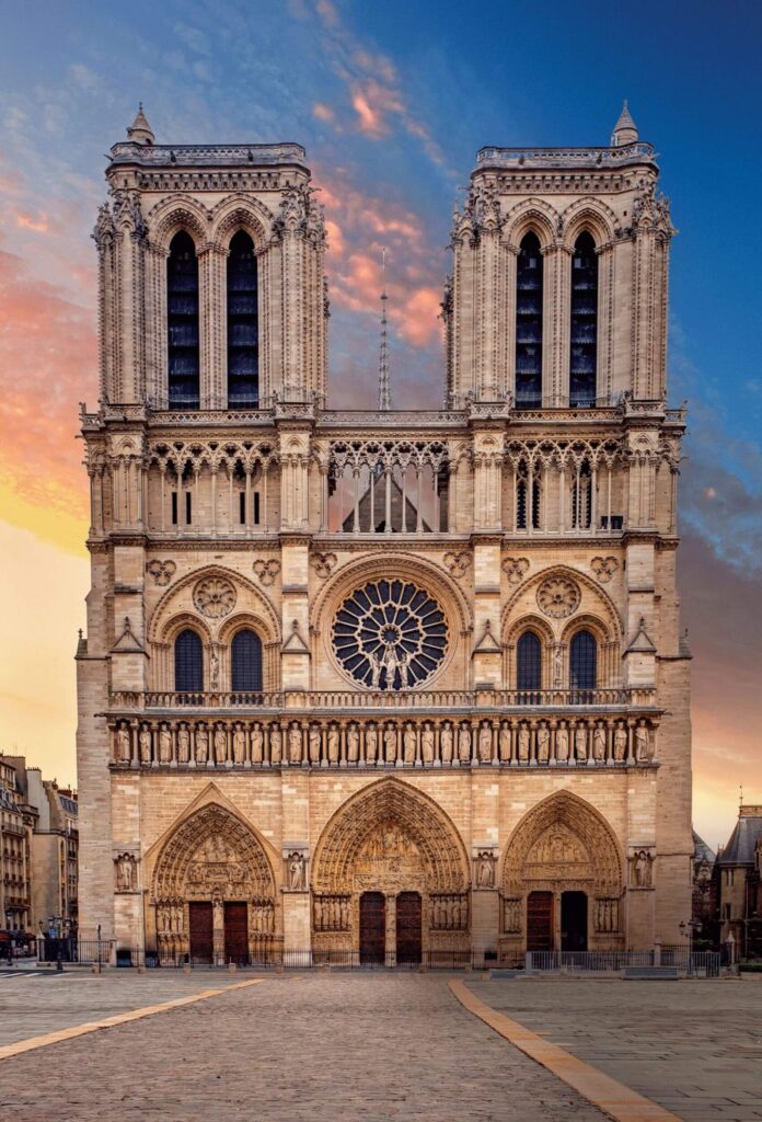 The façade of Notre-Dame Cathedral at sunset, located in the 4th arrondissement of Paris. A historic district popular with American expatriates and real estate investors