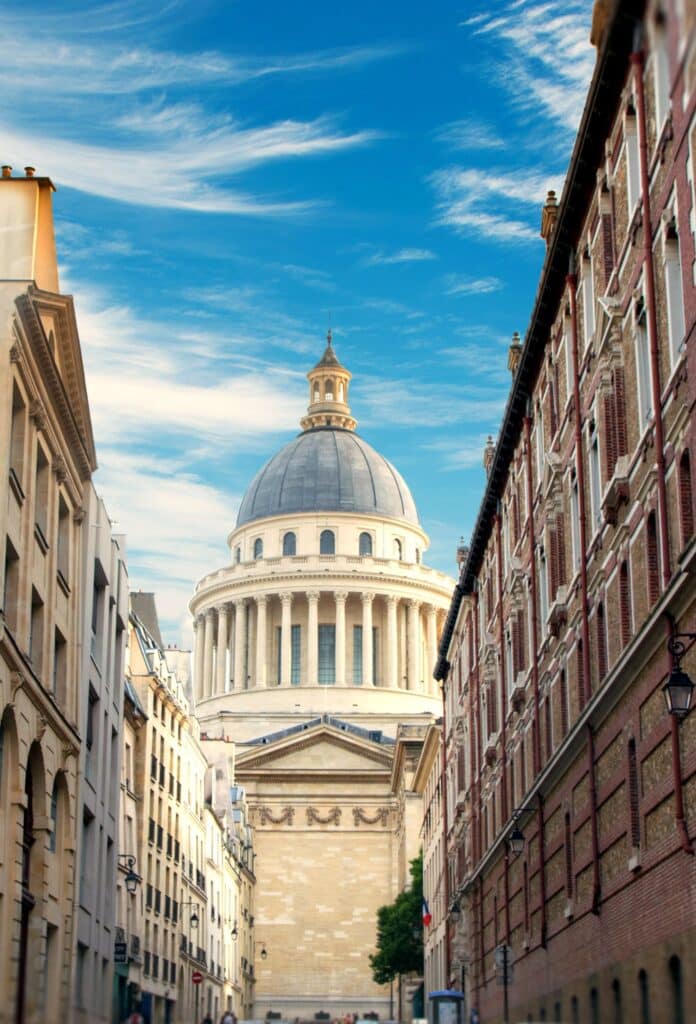 The Panthéon in Paris, an iconic neoclassical monument in the 5th arrondissement, surrounded by historic buildings in the Latin Quarter. A prime location for real estate investment and American expatriates