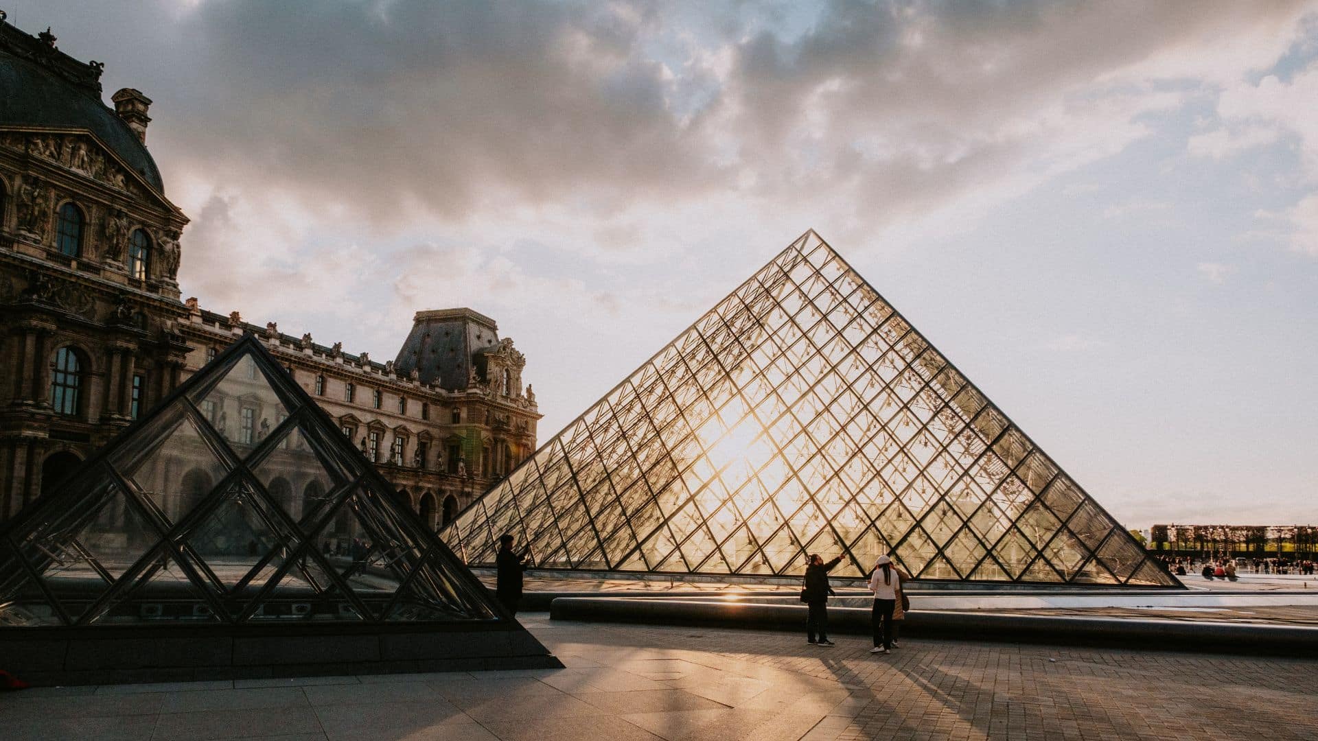 Sunset view of the Louvre Museum glass pyramid in the 1st arrondissement of Paris, France