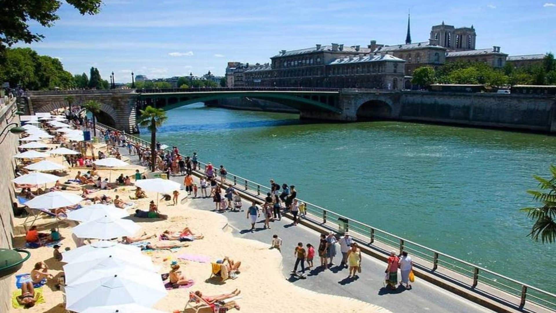 Paris Plages on the Seine River banks in the 1st arrondissement with people relaxing on sun loungers and enjoying summer