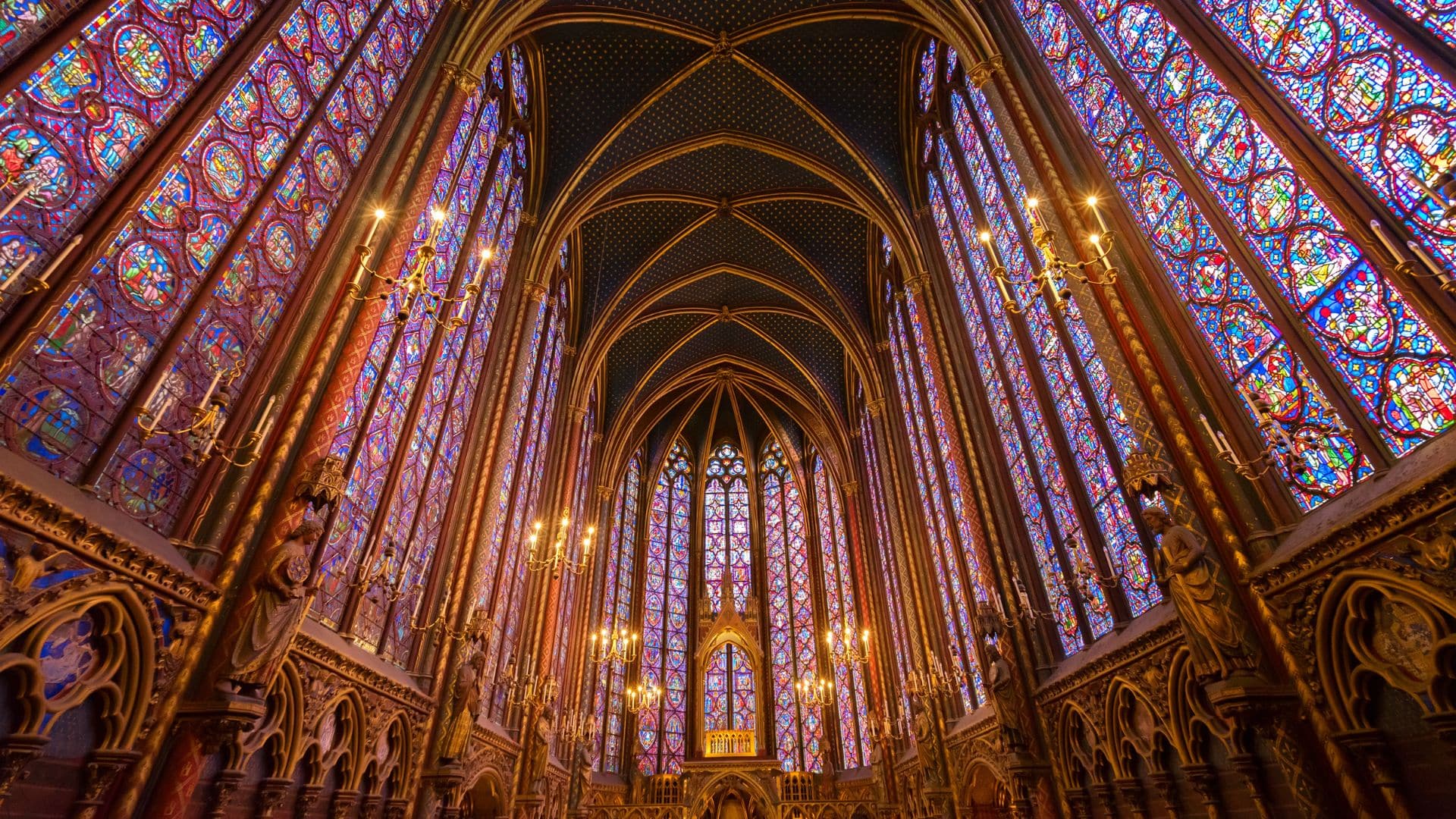 Interior of Sainte-Chapelle with colorful stained glass windows in Paris 1st arrondissement